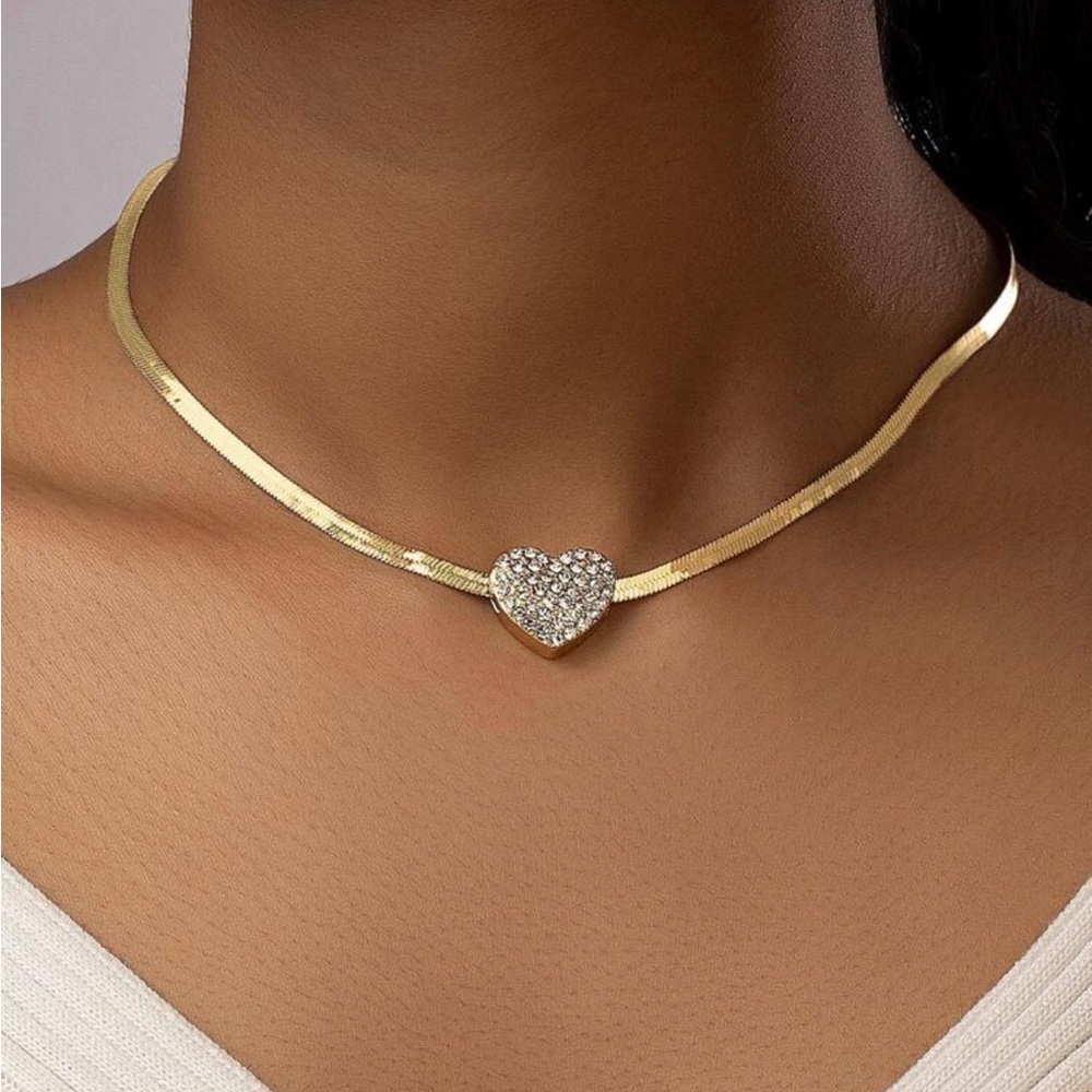 Gold Plated Heart Necklace with Simulated Silver and Diamond Accents.